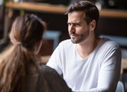Doubting dissatisfied man looking at woman, bad first date concept, young couple sitting at table in cafe, talking, bad first impression, new acquaintance in public place, unpleasant conversation