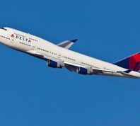 A Delta Air Lines plane in the air after taking off