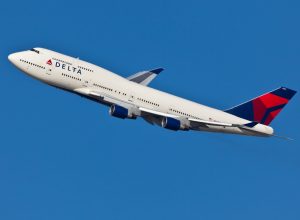 A Delta Air Lines plane in the air after taking off