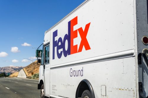 Jun 6, 2020 San Jose / CA / USA - FedEx truck driving on the freeway in South San Francisco bay area