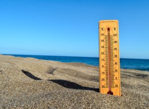 Photo Picture of a Thermometer on the Sand Beach