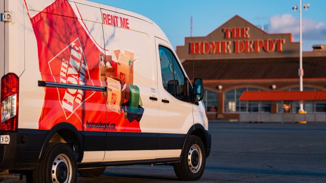 A rented Home Depot van approaching the store.