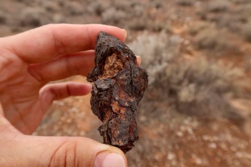 Iron meteorite in the hand
