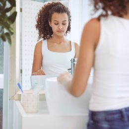 teenager looking in the mirror