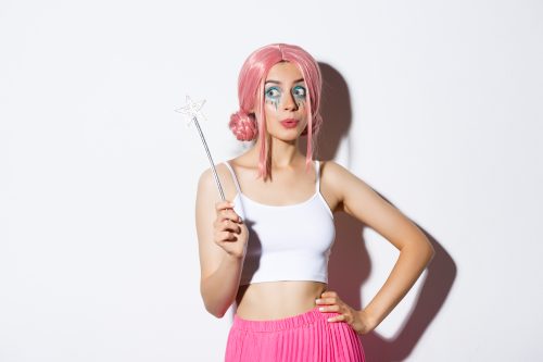 woman dressed up for halloween in a pink wig
