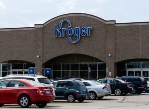 People entering the Kroger store on Dequindre Road in Shelby Township, Michigan. Kroger is a chain of grocery stores founded by Bernard Kroger in 1883 with over 3600 locations nationwide.