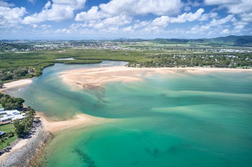 Mackay region and Whitsundays aerial drone image with blue water and rivers over sand banks
