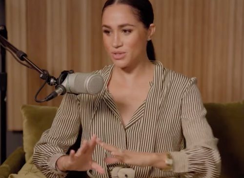 Meghan Markle speaking to a microphone.