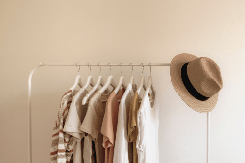neutral clothing on clothes rack