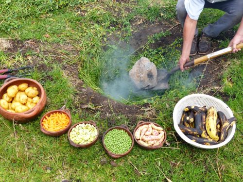The pachamanca is an ancestral cooking process, part of ritual of indigenous people of the Andes and traditional food. Potatoes, carrots, beans, peas are prepared for cooking underground. Ecuador