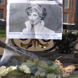 People pay tribute to Princess Diana for 21st anniversary of her death at Golden Gates of Kensington Palace, London, UK.