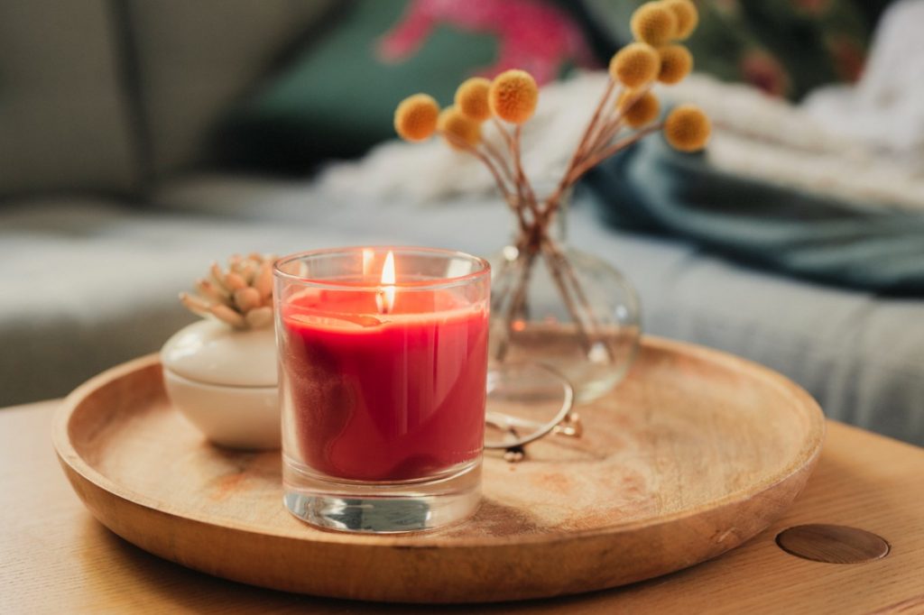 red candle on coffee table