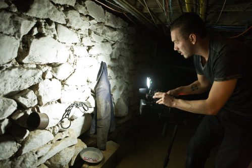 man exploring the shanghai tunnels in Portland