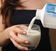 woman pouring milk