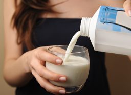 woman pouring milk