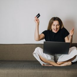 Woman Excitedly Online Shopping