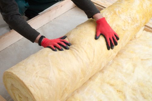 Person Rolling Insulation