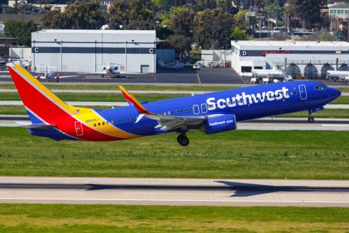 A Southwest Airlines plane taking off from the runway at an airport