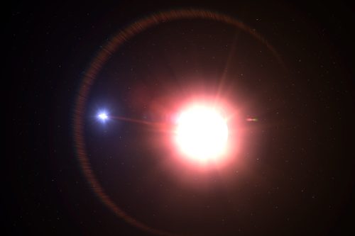 A variable red giant star hundreds of times larger then our own sun, is orbited by a companion star that siphoning stellar material into a disk encircling it.