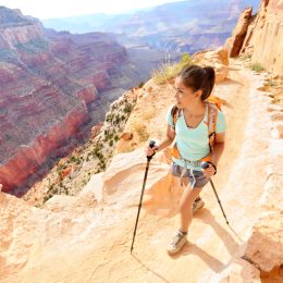 A woman hiking a trail in the Grand Canyon