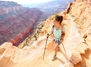 A woman hiking a trail in the Grand Canyon