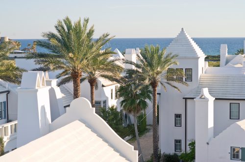 A rooftop view of the white buildings and palm trees in Alys Beach, Florida.