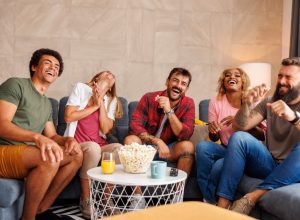 Group of friends laughing and playing game