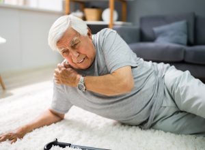 Senior man fall risk falling in living room