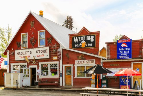 Facade of stores and pubs in the small oldtown of Talkeetna, Alaska.