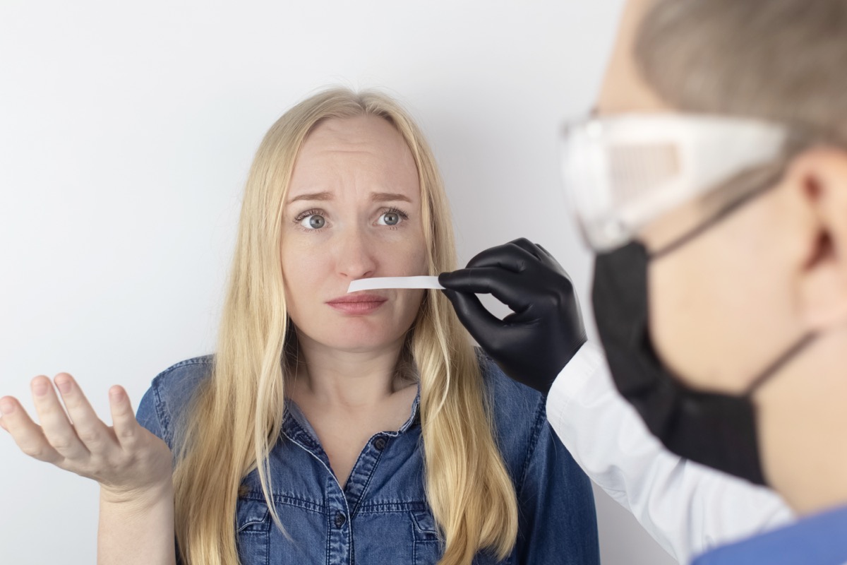 Woman taking smell test