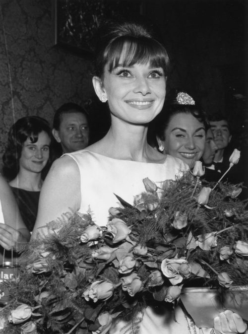 Audrey Hepburn photographed holding flowers in 1961