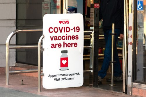 Covid-19 vaccines are here sign advertises coronavirus vaccination location at CVS Pharmacy store. - Palo Alto, California, USA - February, 2021