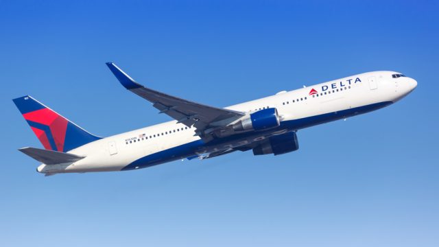 A Delta Air Lines plane taking off from an airport