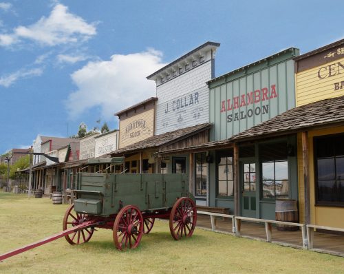 Façade of the Front Street replica with an old chuck wagon at the Boot Hill historical museum in Dodge City, Kansas.