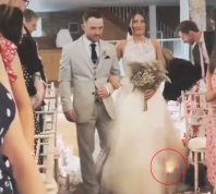 ​​Video Shows Bride's Gown Catching Fire Twice Without Her Even Noticing