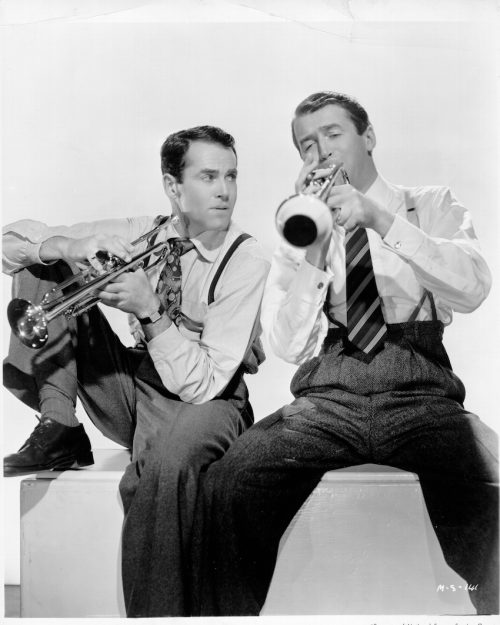 Henry Fonda and Jimmy Stewart playing trumpets in a photo circa 1947