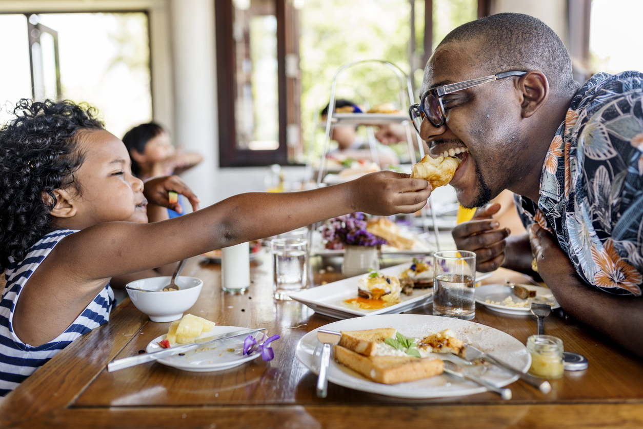black family enjoying breakfast together