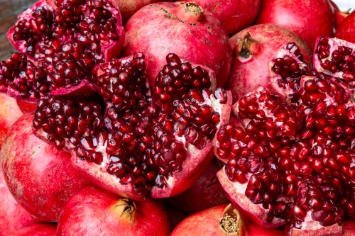 Close up of fresh harvested juicy pomegranate