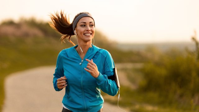 Female athlete running outdoors.