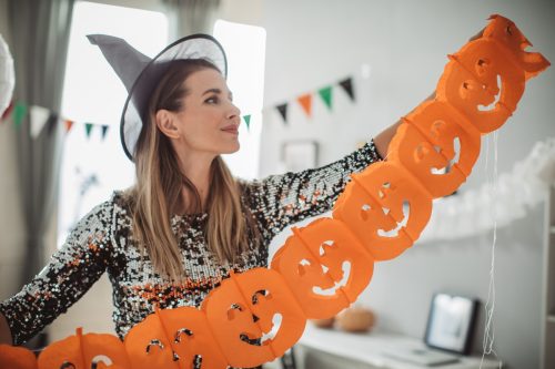 woman decorating for halloween