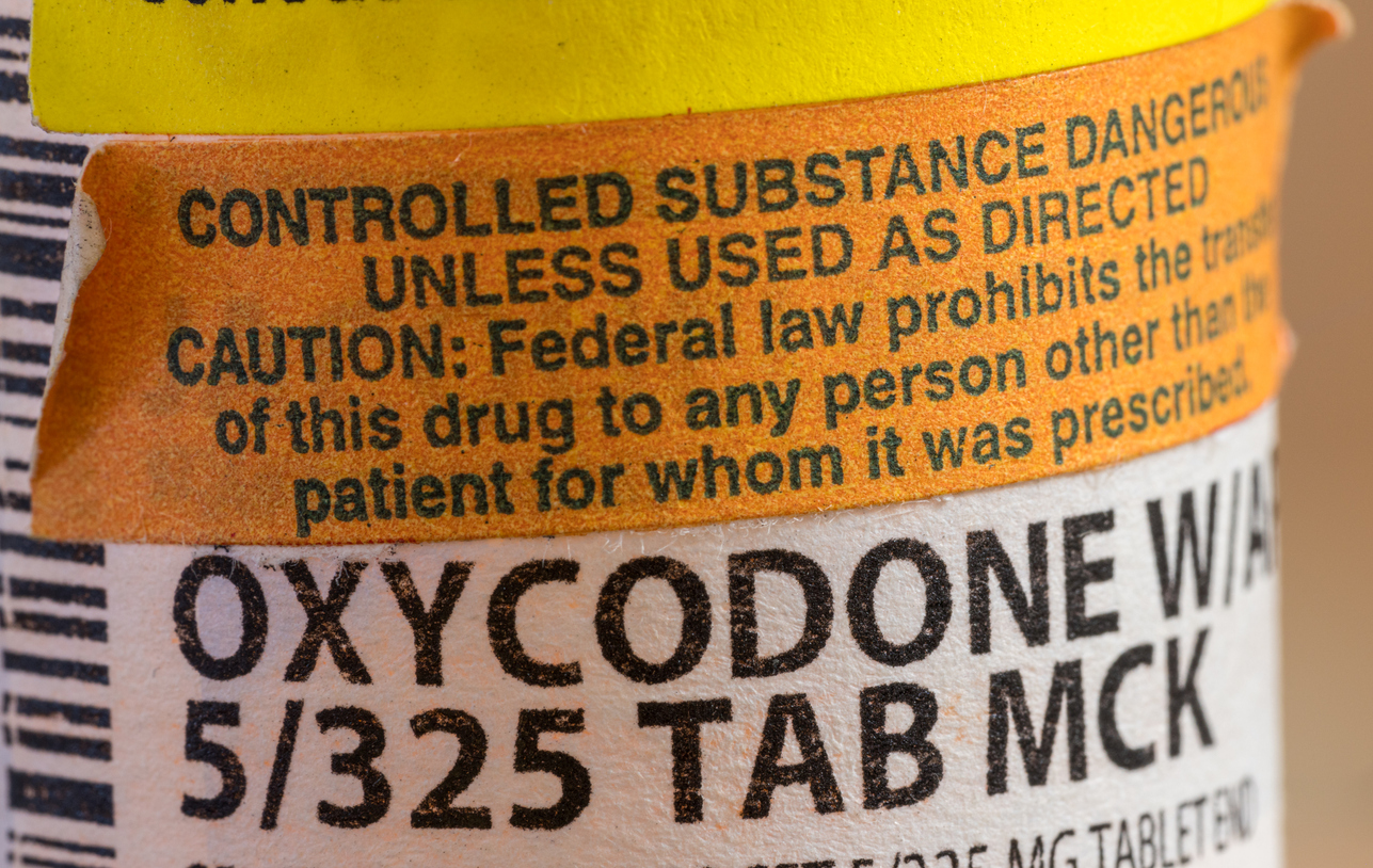 Close-up of a bottle of opioid tablets.
