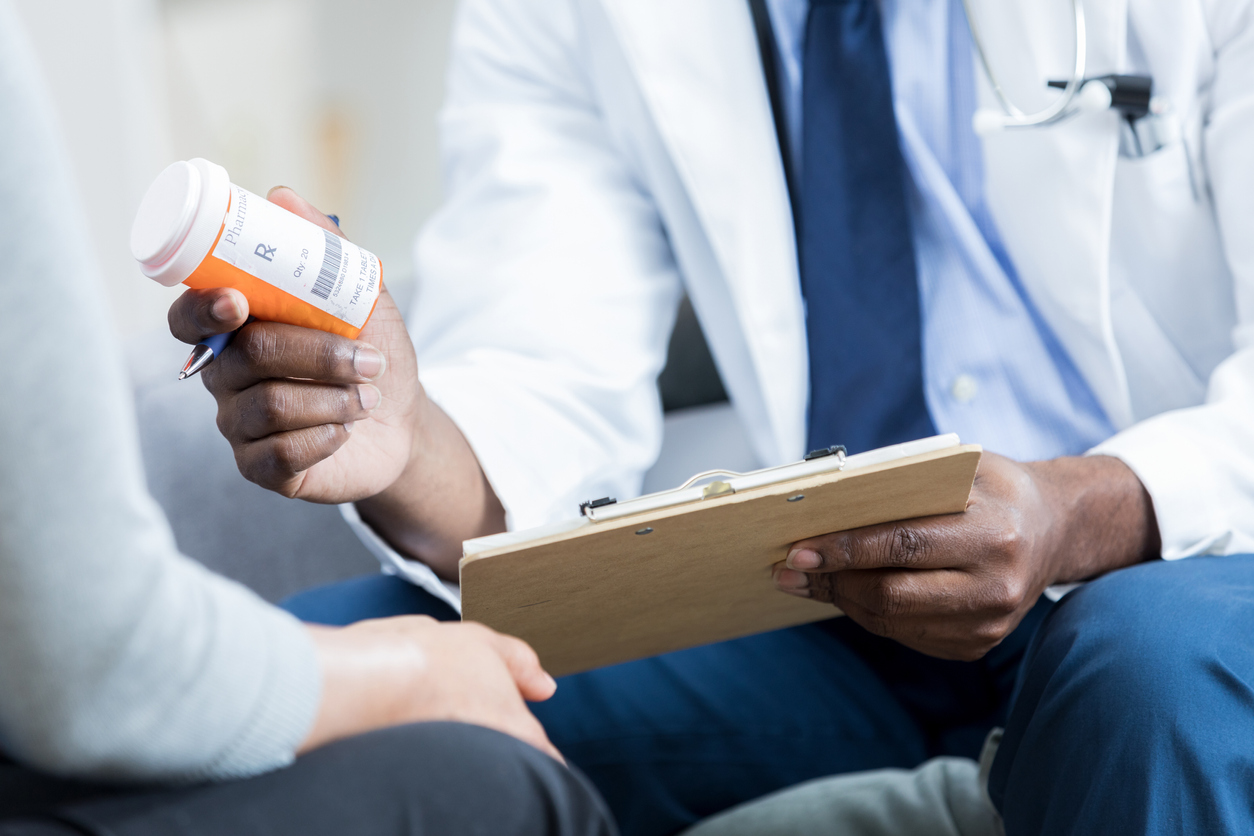 Doctor prescribing medication to a patient.