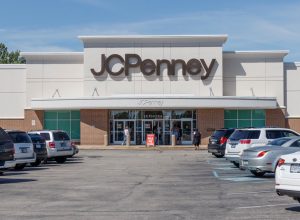 JCPenney location in a retail mail with cars in parking lot