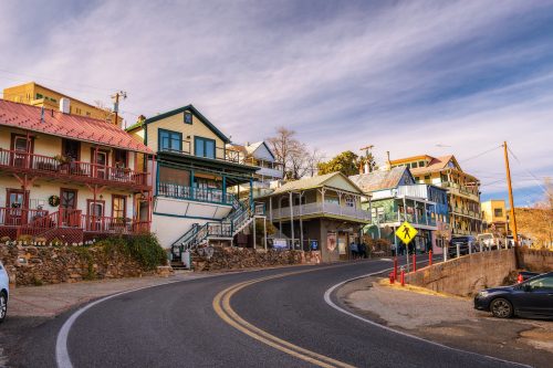 View of the quirky houses on a hilly street in Jerome, Arizona.