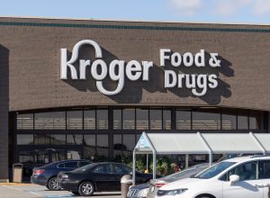 A closeup of a Kroger Food & Drugs store with white logo.