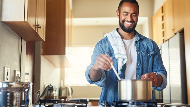 man cooking healthy meals to fight cancer