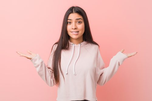 most likely to questions for teens - young girl shurgging her shoulders