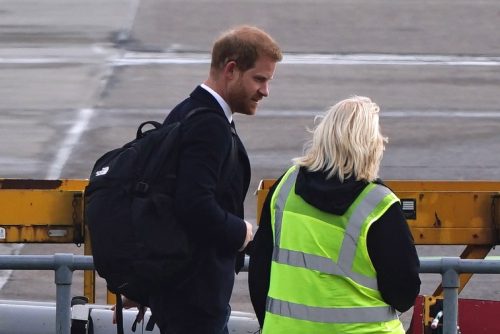 The Duke of Sussex boards a plane at Aberdeen Airport as he travels to London following the death of Queen Elizabeth II