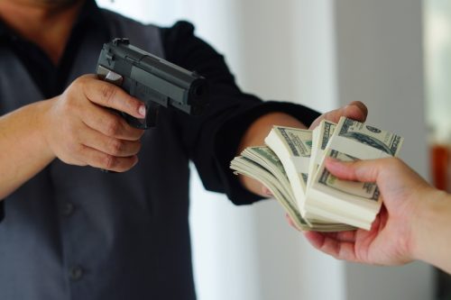 Man carrying a gun to rob the bank 