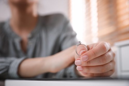 woman holding engagement ring